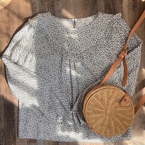 Loft:  white and black floral blouse with ruffle neck detailing